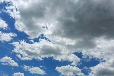 Blue sky with some white clouds Stock Photos