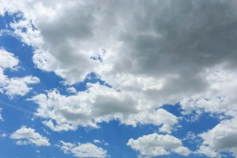 Blue sky with some white clouds Stock Photos