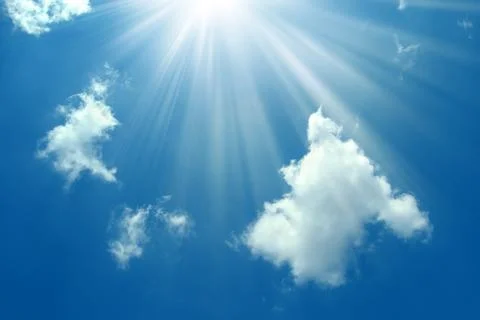 A blue sky with sun and clouds background...Shining sun on blue sky with clou Stock Photos