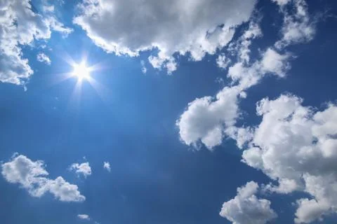 Blue sky sun and white clouds Stock Photos