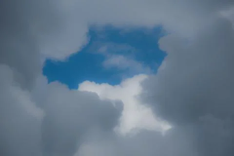 Blue Sky Surrounded by Clouds Stock Photos
