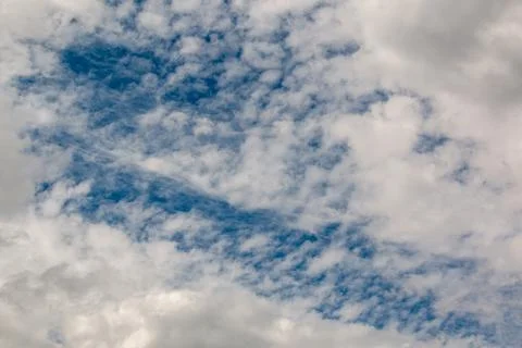 Blue sky surrounded by clouds Stock Photos