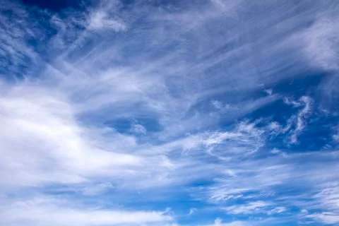 Blue sky texture with light transparent clouds Stock Photos
