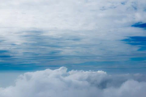The blue sky with thick clouds floats and looks beautiful. Stock Photos