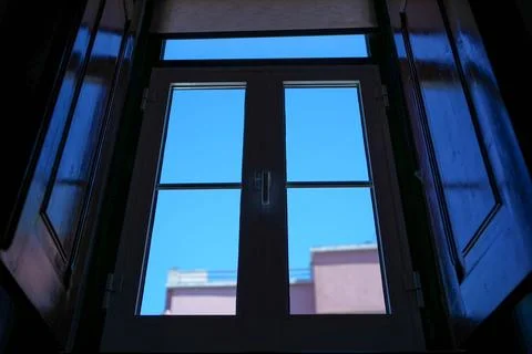 Blue sky through a window Stock Photos