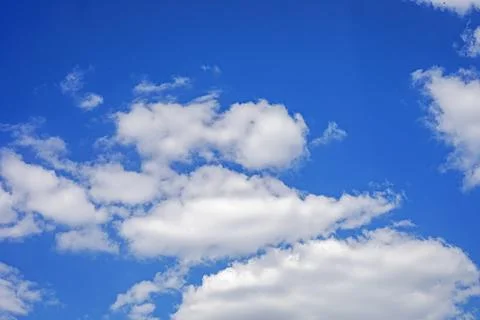 Blue sky with thunderclouds and cumulus clouds Stock Photos