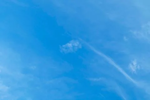 Blue Sky with Tiny and Fluffy White Clouds Stock Photos