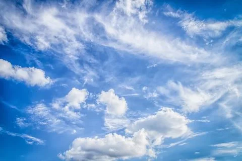 Blue sky with tiny clouds Stock Photos