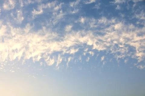 Blue sky with tiny clouds, sky background Stock Photos