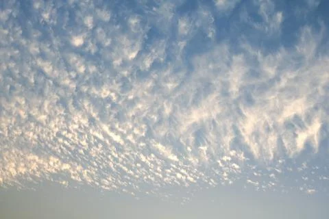 Blue sky with tiny clouds, sky background Stock Photos