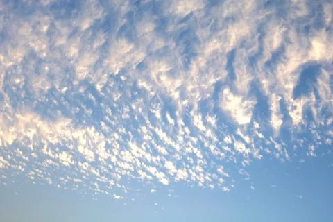 Blue sky with tiny clouds, sky background Stock Photos