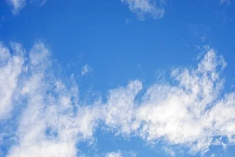 A blue sky with undulating clouds Stock Photos