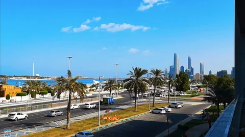Blue sky view of Abu Dhabi city towers, skyline and corniche Stock Footage 98793019