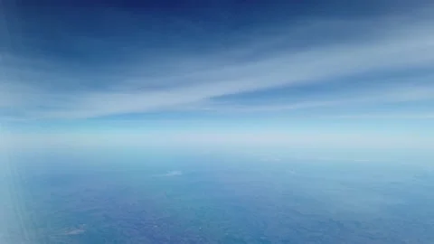 Blue sky view from an airplane window. Air travel Video stock 224554175