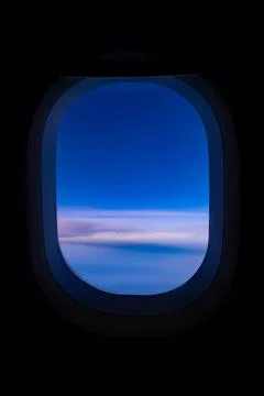 Blue sky view from airplane window with dark copy space for text Stock Photos