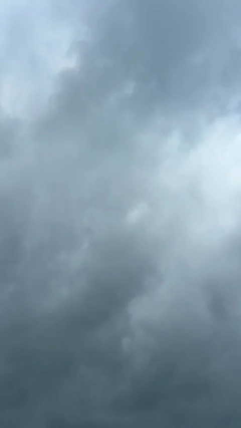 Blue sky view through dramatic fluffy clouds on sunny day Stock Footage 311982380