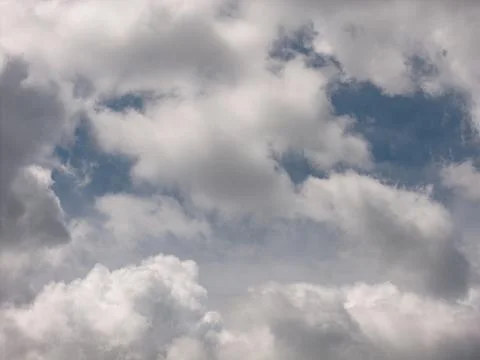 Blue sky viewing small white clouds during day Foto stock