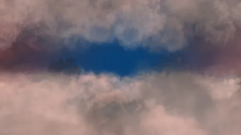 Blue Sky Visible Through Dense Fluffy Clouds in a Stunning Contrast Stock Footage 304422638