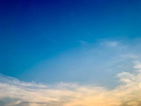 Blue Sky with Warm Evening Wispy Clouds Over Jakarta Stock Photos