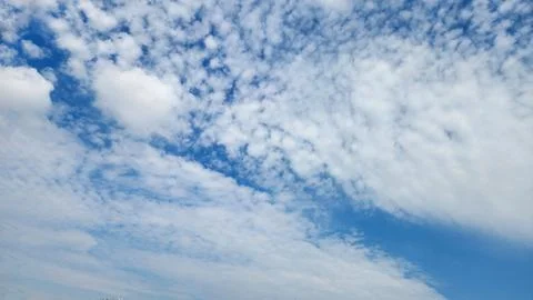 Blue sky with white cirrocumulus clouds Stock Photos