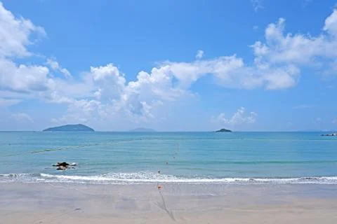 Blue sky, white cloud, mountain, beach ocean with wave Stock Photos