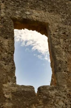 Blue sky with a white cloud seen through Stock Photos