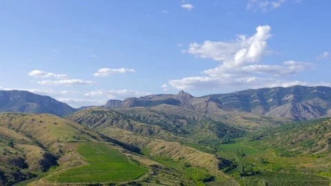 Blue sky with white clouds above mountain , time lapse Video stock 79451731