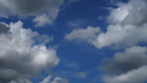 A blue sky with white clouds is adorned with a brilliant shade of blue 스톡 동영상 280096284