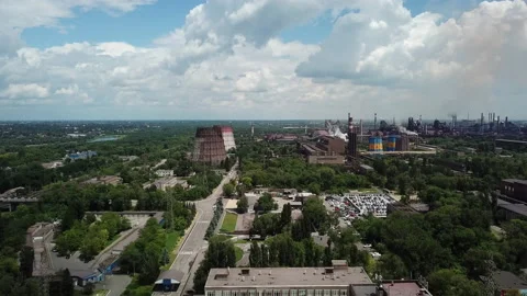 Blue sky with white clouds against the background of a steaming  plant Stock Footage 196401171