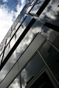 Blue sky, white clouds and modern office building in London, England Ilustración de archivo