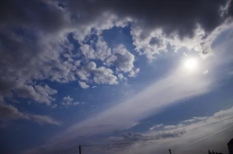 Blue sky with white clouds and sun. Nature background. Sky background. Stock Photos