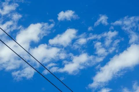 Blue Sky With White Clouds and Wires Stockfoto's