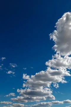Blue sky with white clouds as a backdrop Stock Photos