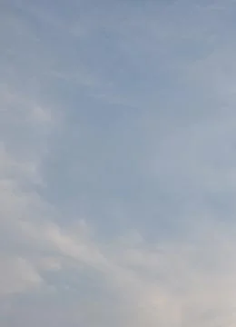Blue sky with white clouds as a background. Stock Photos