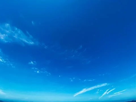 Blue sky with white clouds background. Clear sunny day Stock Photos