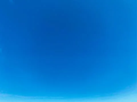 Blue sky with white clouds background. Clear sunny day Stock Photos