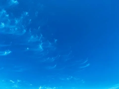 Blue sky with white clouds background. Clear sunny day Stock Photos