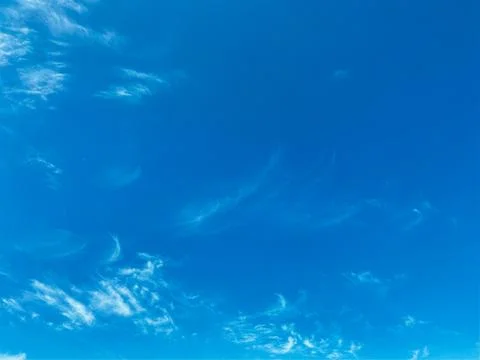 Blue sky with white clouds background. Clear sunny day Stock Photos