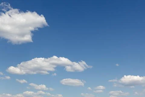 Blue sky with white clouds, background for design Stock Photos