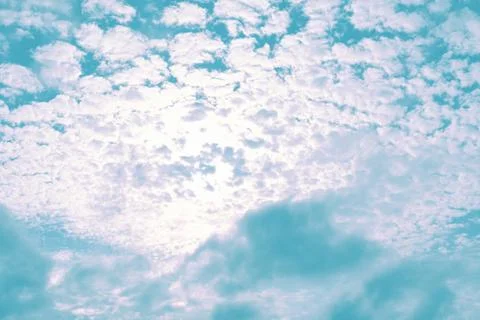 Blue sky with white clouds that is backlit by the sun. Concept landscape, bac Stock Photos