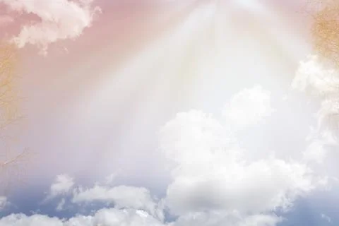 Blue sky with white clouds backlit by sunlight Stock Photos