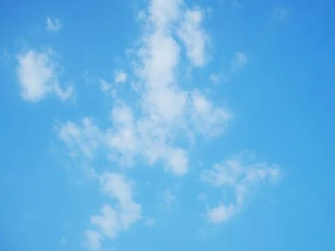 Blue sky with white clouds close-up. Texture, template Stock Photos