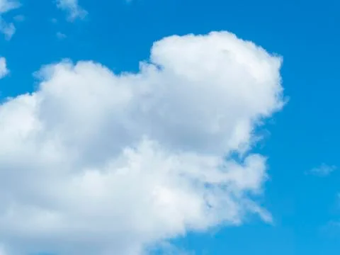 Blue sky with white clouds close-up. Texture, template Stock Photos