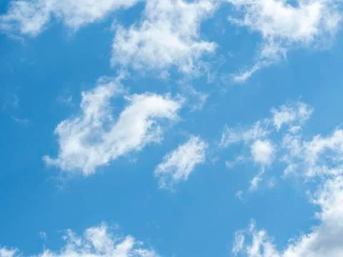 Blue sky with white clouds close-up. Texture, template Stock Photos