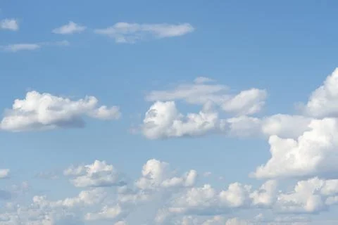 Blue sky with white clouds close-up. Texture, template Stock Photos