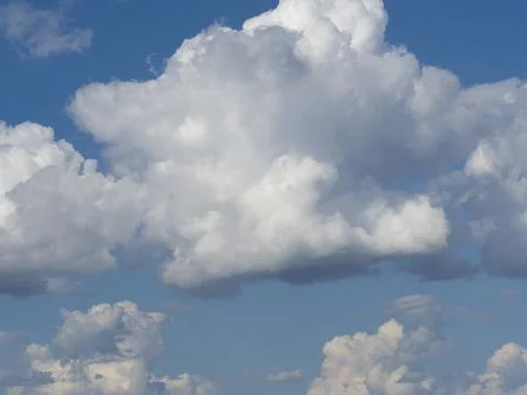 Blue sky with white clouds close-up. Texture, template Stock Photos