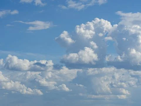 Blue sky with white clouds close-up. Texture, template Stock Photos