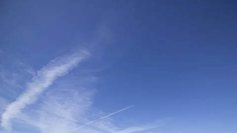 Blue sky white clouds contrails timelapse Stock Footage 107611315