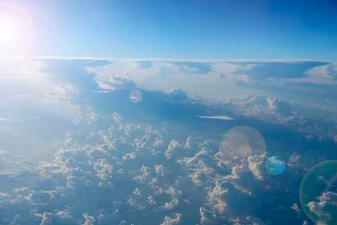 Blue sky with white clouds. Flight over clouds. Celestial abyss Stock Photos