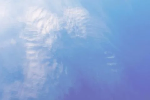 Blue sky with white clouds that form the wings of an angel. Concept landscape Stock Photos